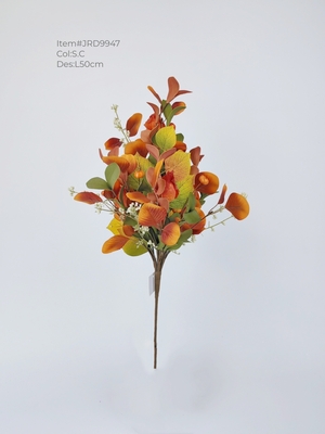 Autumn eucalyptus leaves bunch with mini pumpkins and berries